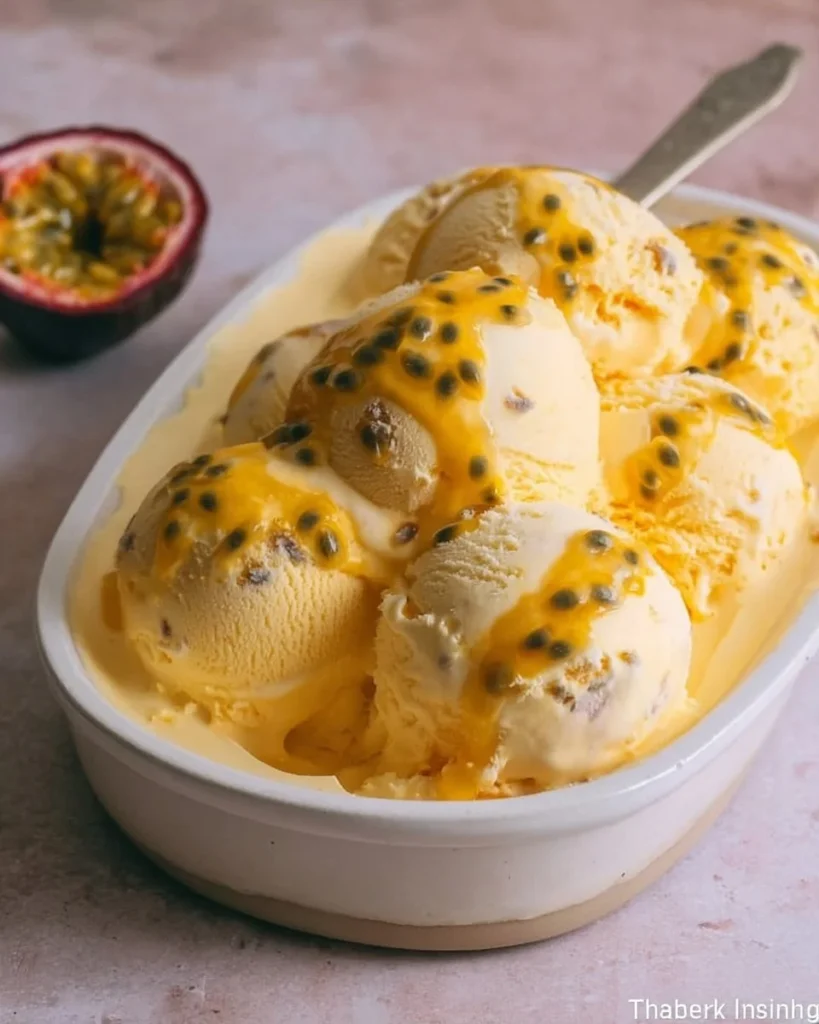Creamy passion fruit ice cream served in a bowl with fresh fruits