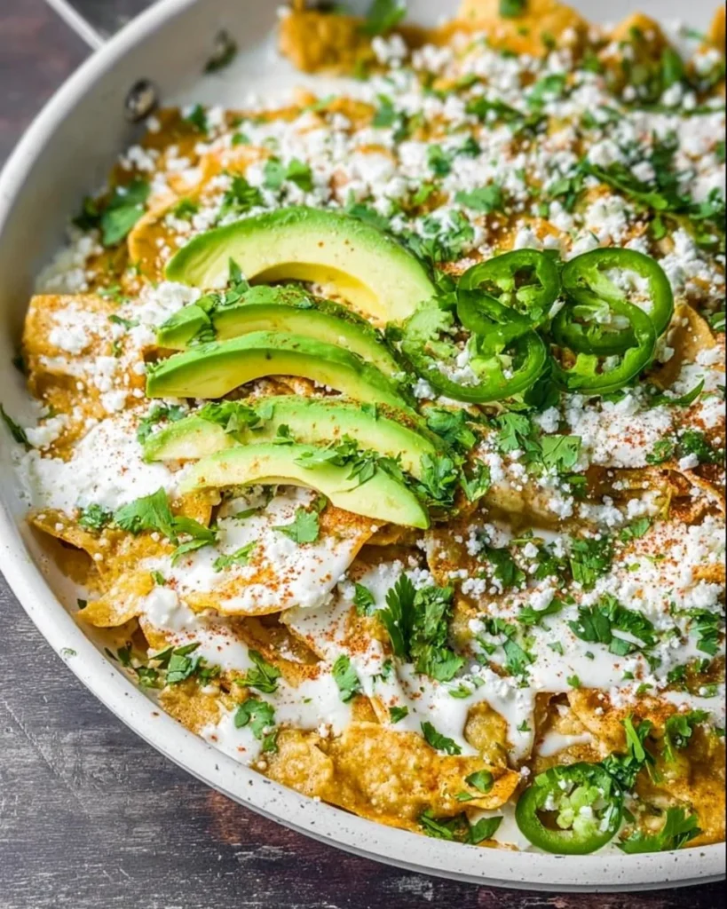 Delicious green chilaquiles topped with fresh ingredients