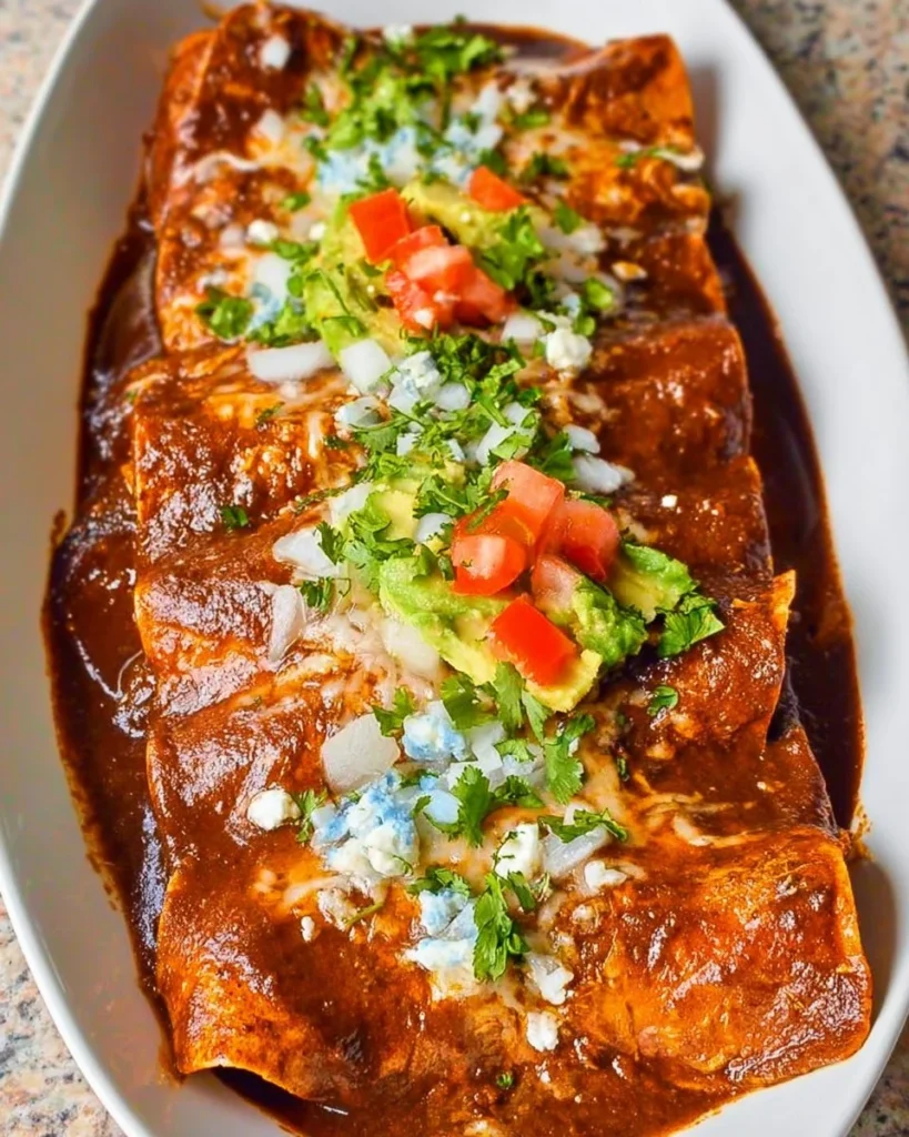 Delicious Mexican Mole Enchiladas served with fresh toppings