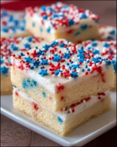 Patriotic sugar cookie bars decorated for a festive celebration