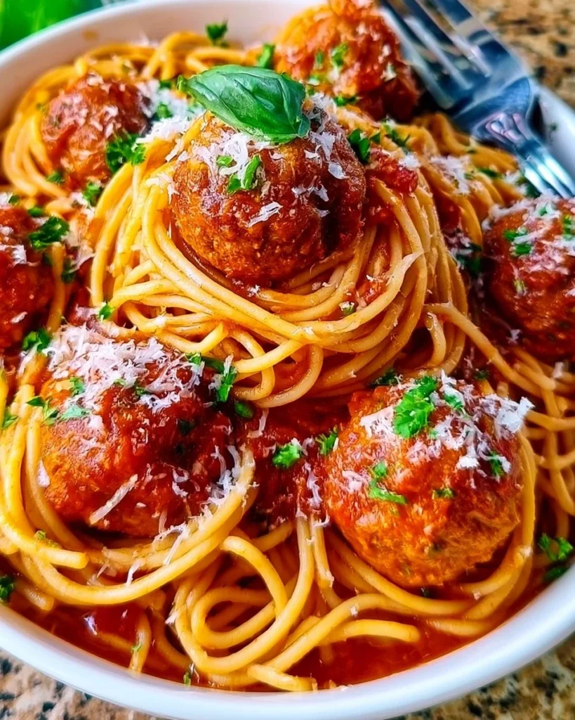Delicious meatball spaghetti served in a bowl with marinara sauce